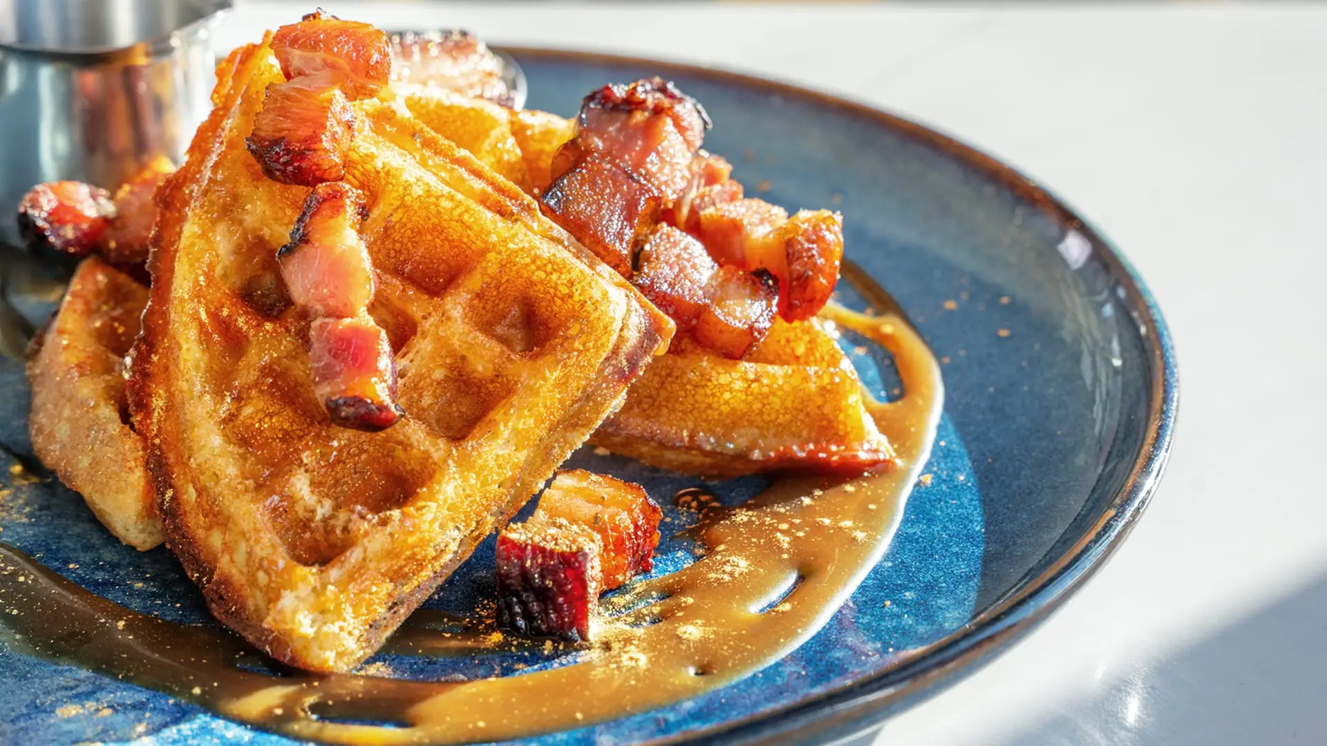 Smoked bacon stuffed Belgian waffle, slow roasted bacon lardons, salted caramel, gold dust, Quebec maple syrup