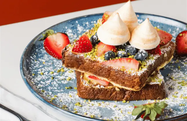Brioche French toast, lemon curd, fresh berries, pistachios, torched pavlovas